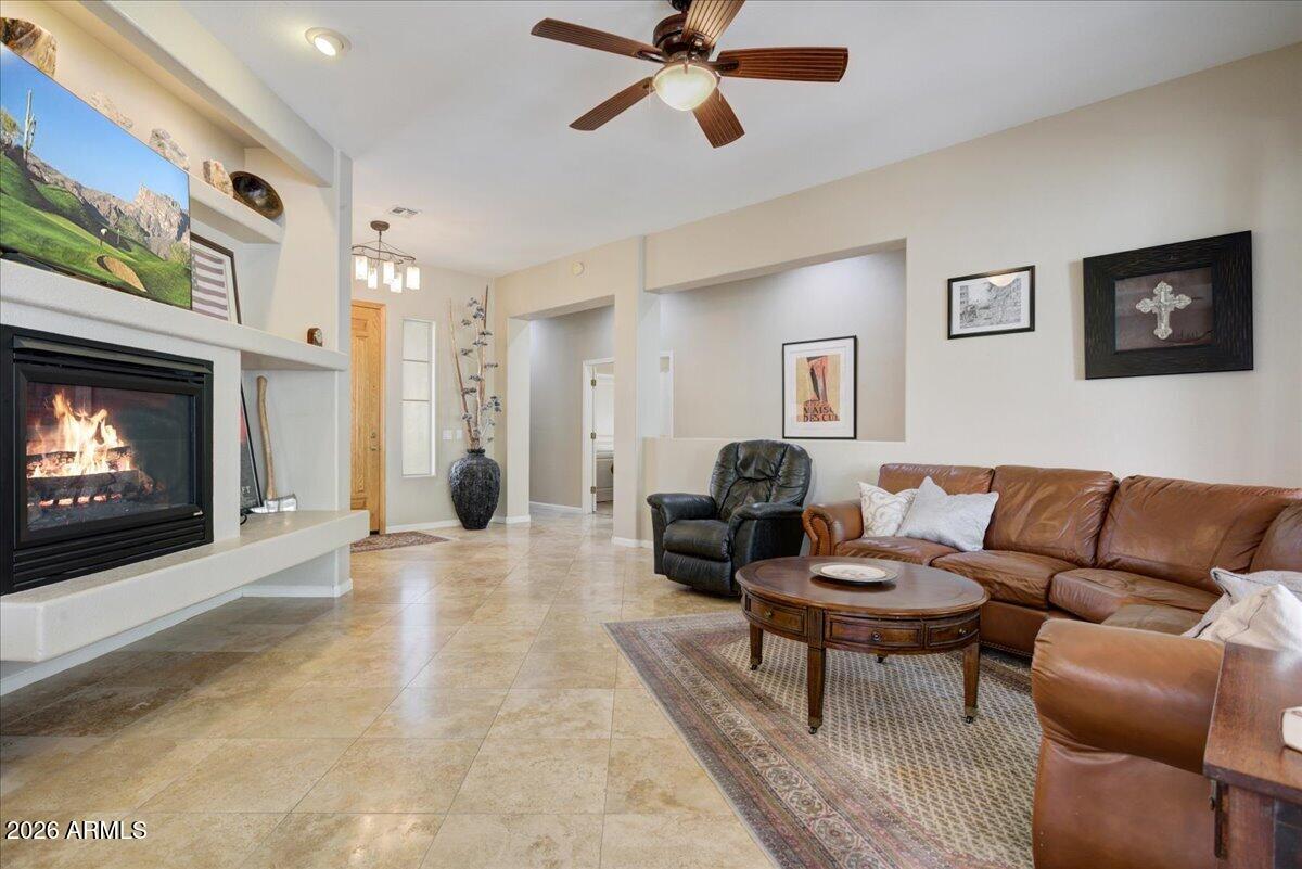 4906 East Wagoner Road Scottsdale, AZ 85254 - Photo 5 of 29 a living room with furniture and a fireplace