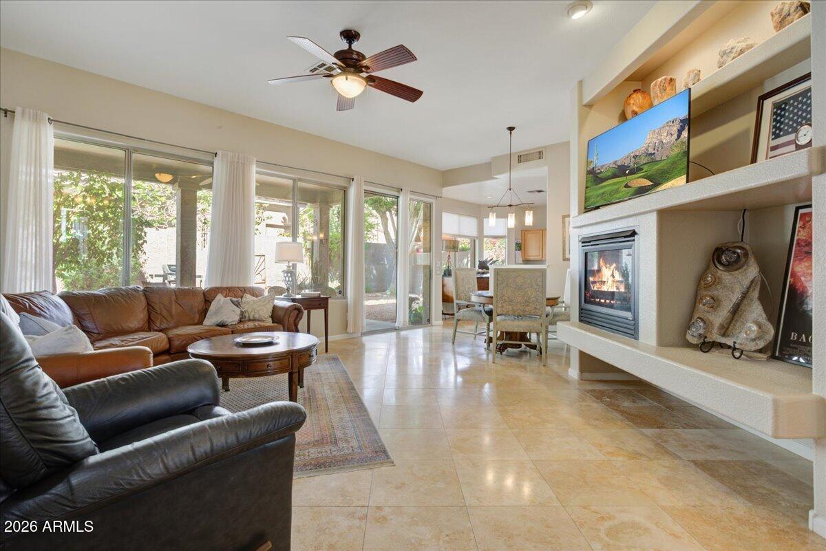4906 East Wagoner Road Scottsdale, AZ 85254 - Photo 6 of 29 a living room with furniture and a flat screen tv