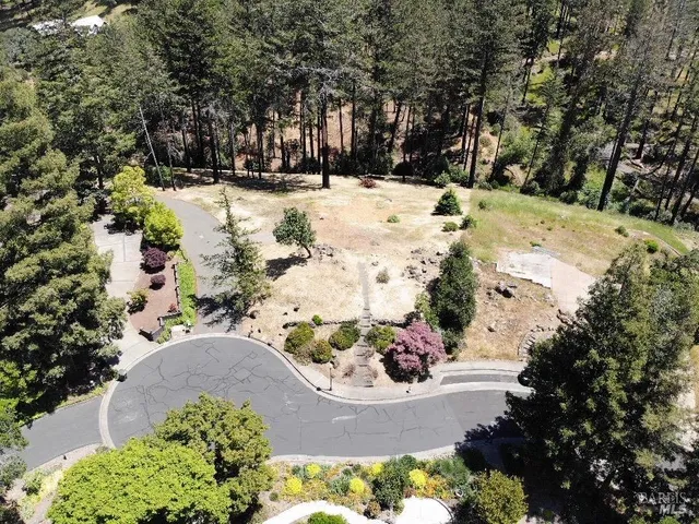 a view of a yard covered with snow in a yard