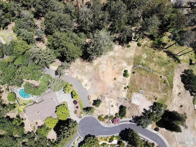 an aerial view of house with yard