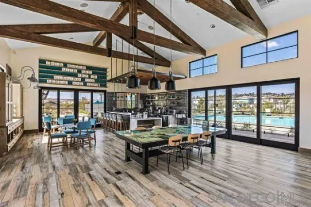 a living room with furniture a fireplace and wooden floor