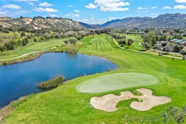 a view of a swimming pool with a yard