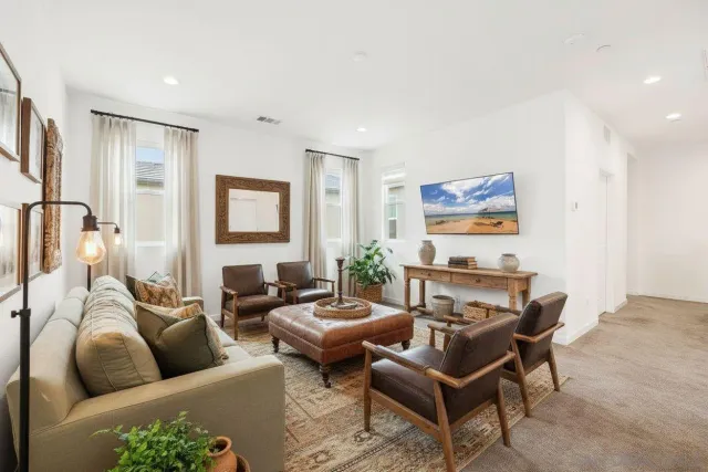 a living room with furniture and a couch