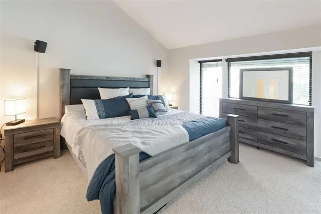 a bedroom with a bed and a dresser