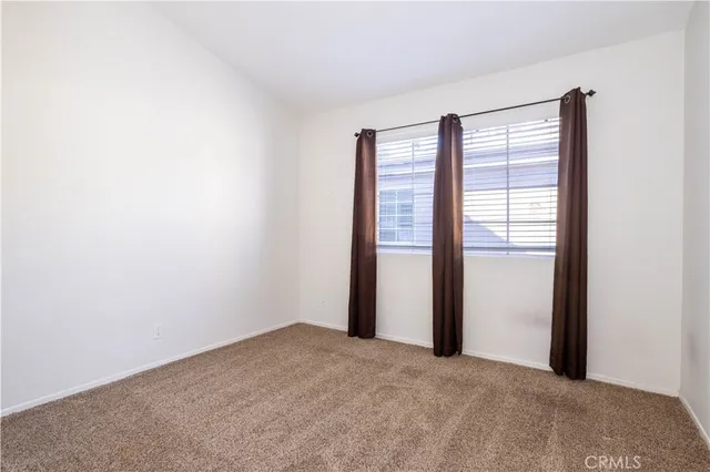 a view of a room with a large window