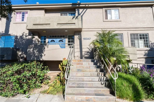 a view of a potted plants on a sidewalk