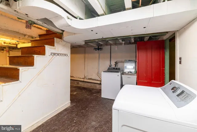 a utility room with dryer and washer