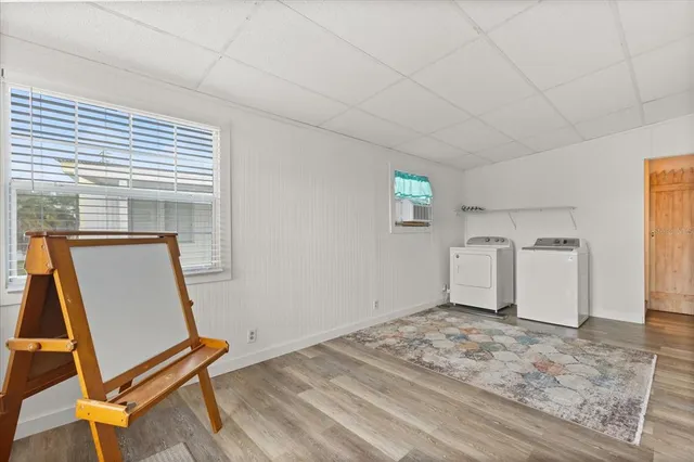 a view of a livingroom with wooden furniture