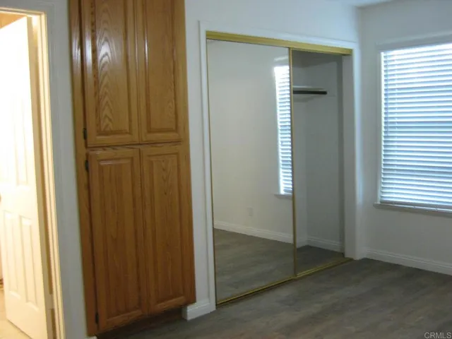 an empty room with wooden floor