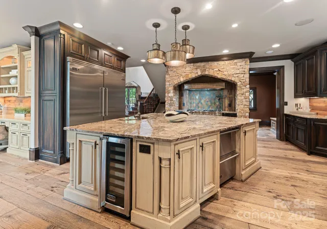 a kitchen with a sink and a stove top oven