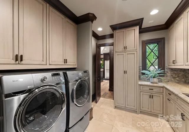 a view of a hallway with washer and dryer