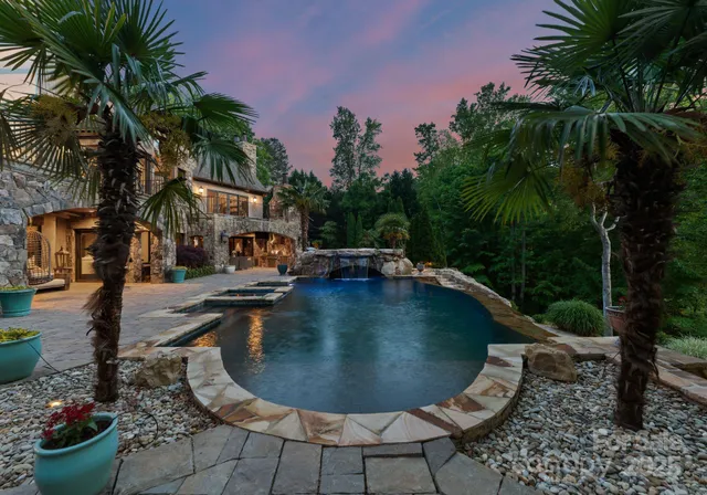 a view of a swimming pool with lounge chair