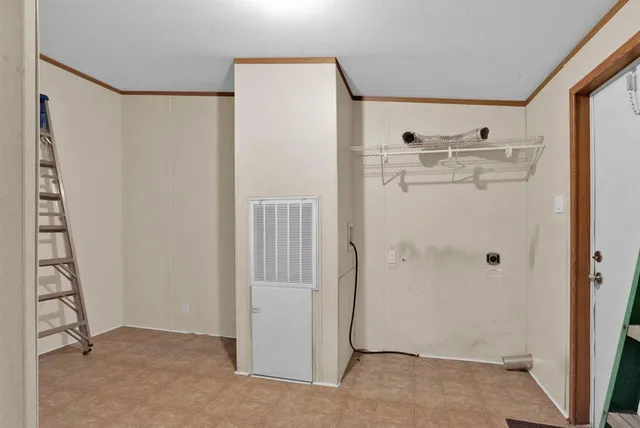 a view of walk in closet with window