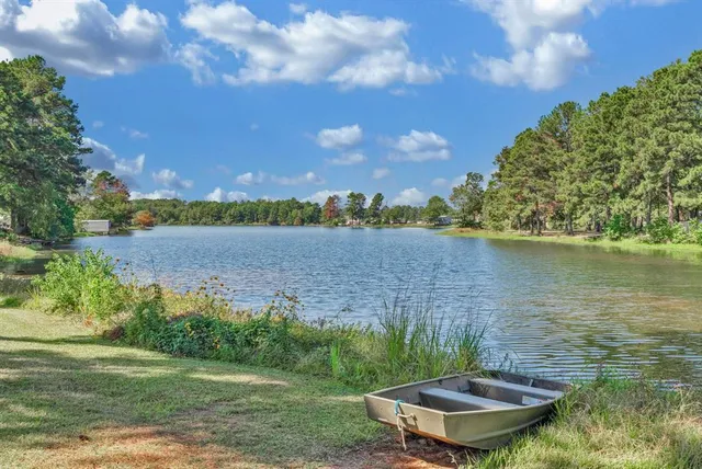 a view of a lake with a yard