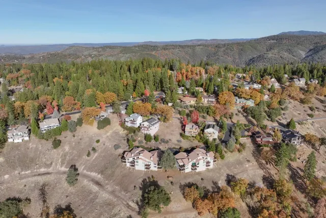 a view of a city with mountains in the background