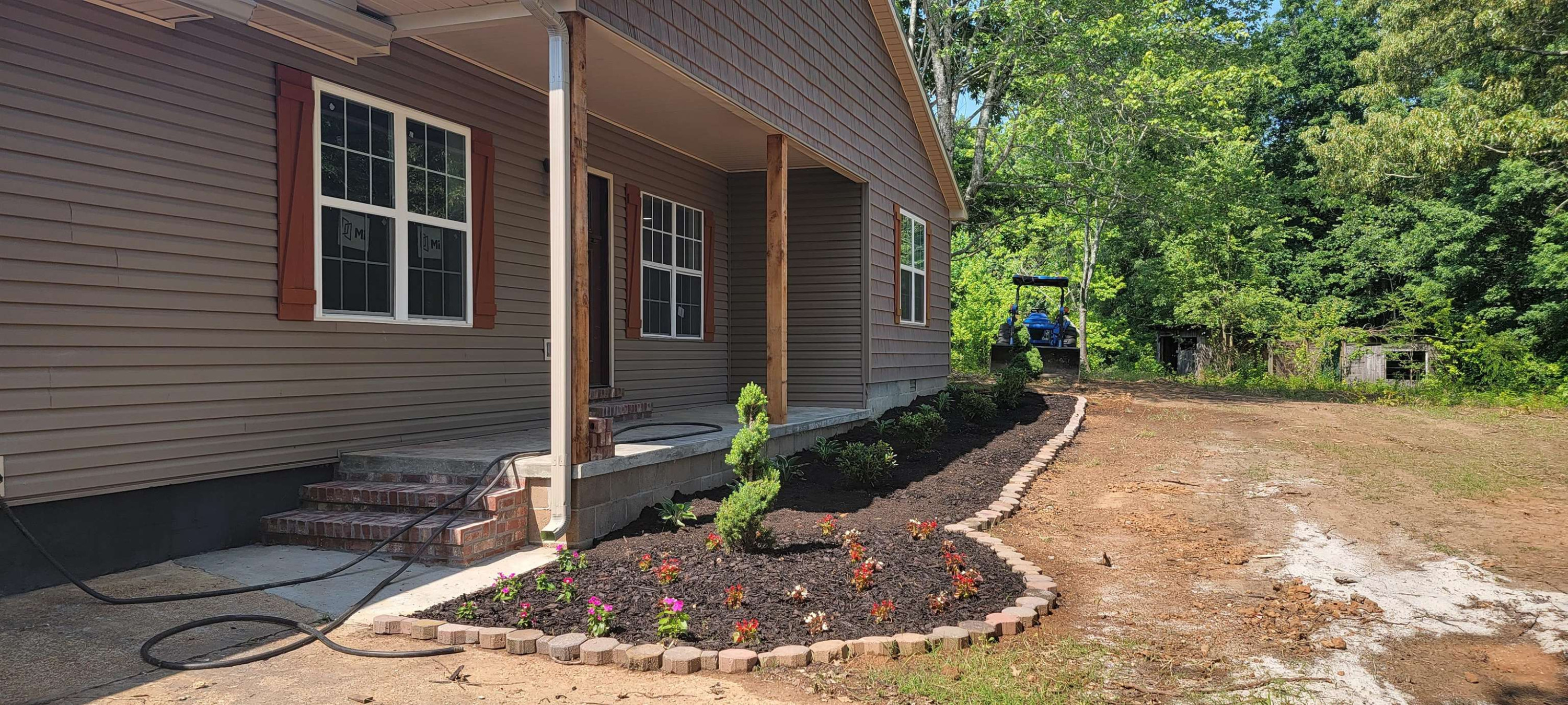 920 Tyler Road Lexington, TN 38351 - Photo 11 of 17 a view of a backyard with plants and trees