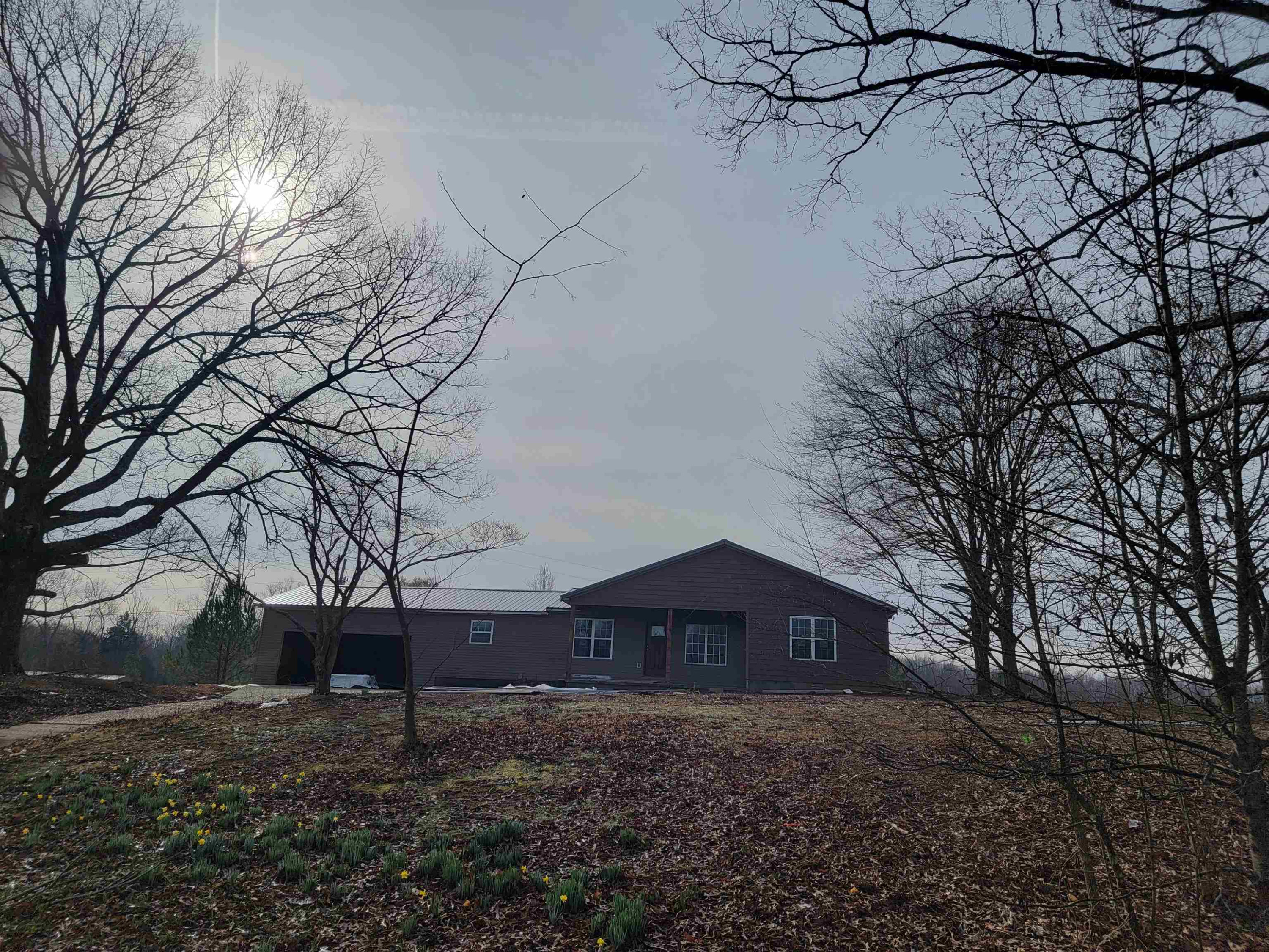 920 Tyler Road Lexington, TN 38351 - Photo 12 of 17 a barn house with a yard and large trees