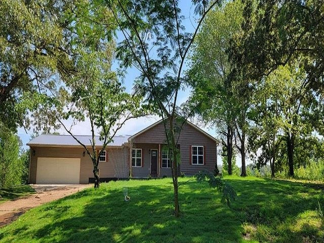 920 Tyler Road Lexington, TN 38351 - Photo 10 of 17 a front view of house with yard and green space