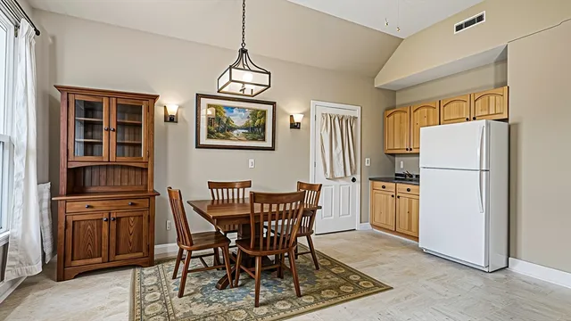 a view of a dining room with furniture