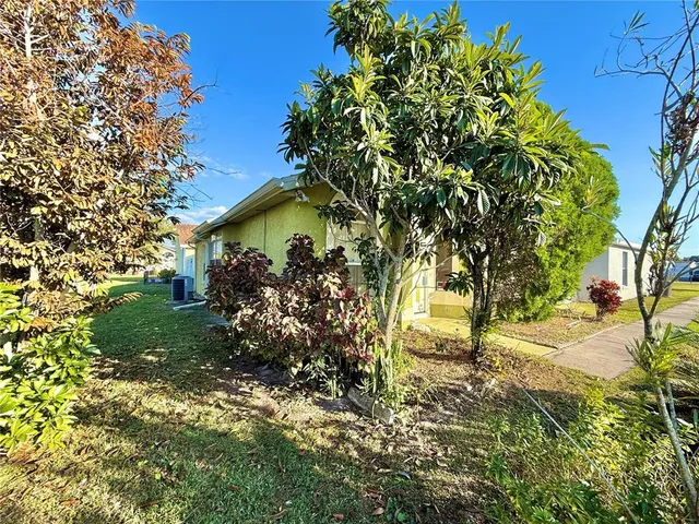 a backyard of a house with lots of green space