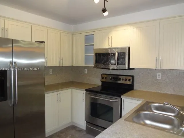 a view of a small space with wooden floor