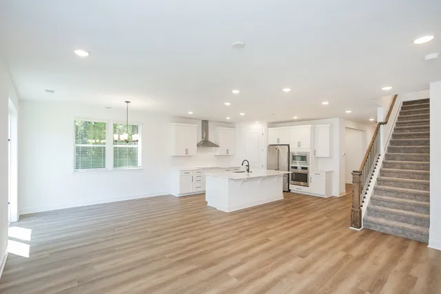 a kitchen with sink and windows