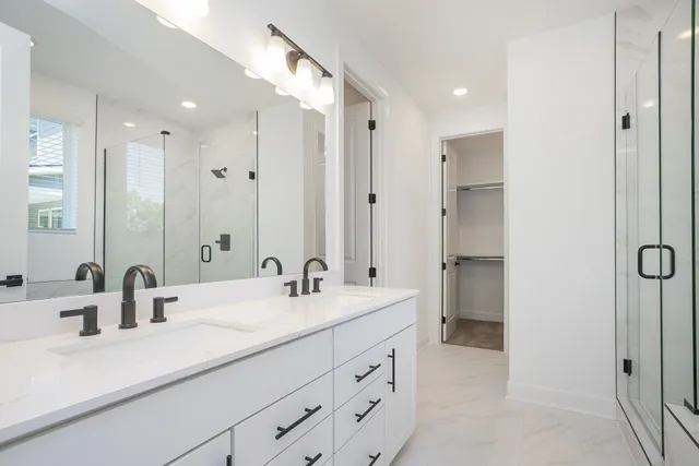 a bathroom with a shower and a window