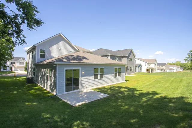 a front view of a house with yard