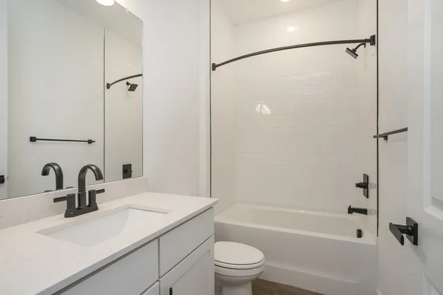 a kitchen with refrigerator cabinets and a sink
