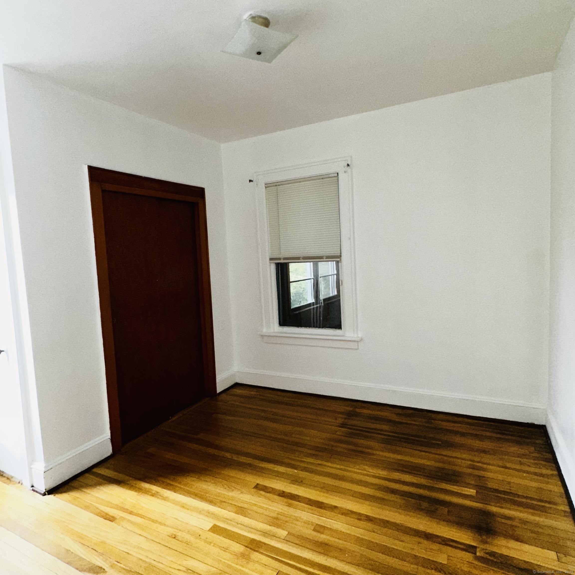 20 Amaryllis Avenue Waterbury, CT 06710 - Photo 11 of 21 a view of an empty room with wooden floor