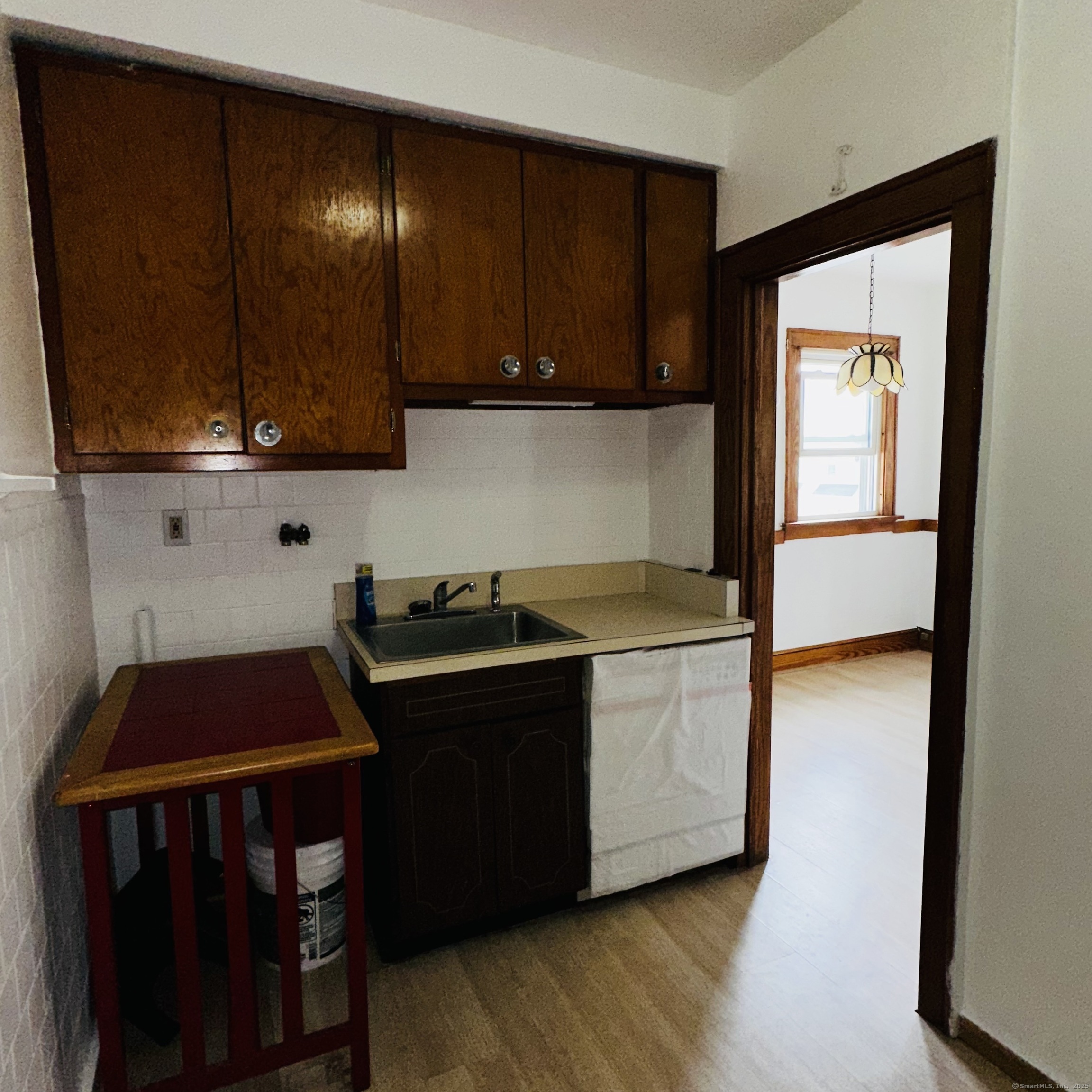 20 Amaryllis Avenue Waterbury, CT 06710 - Photo 18 of 21 a kitchen with wooden cabinets and a stove top oven