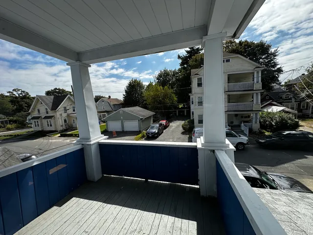 a view of kitchen with sink and wooden floor