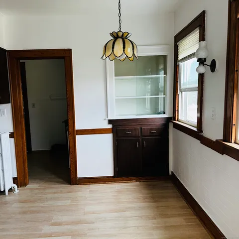 a kitchen with a refrigerator and a sink
