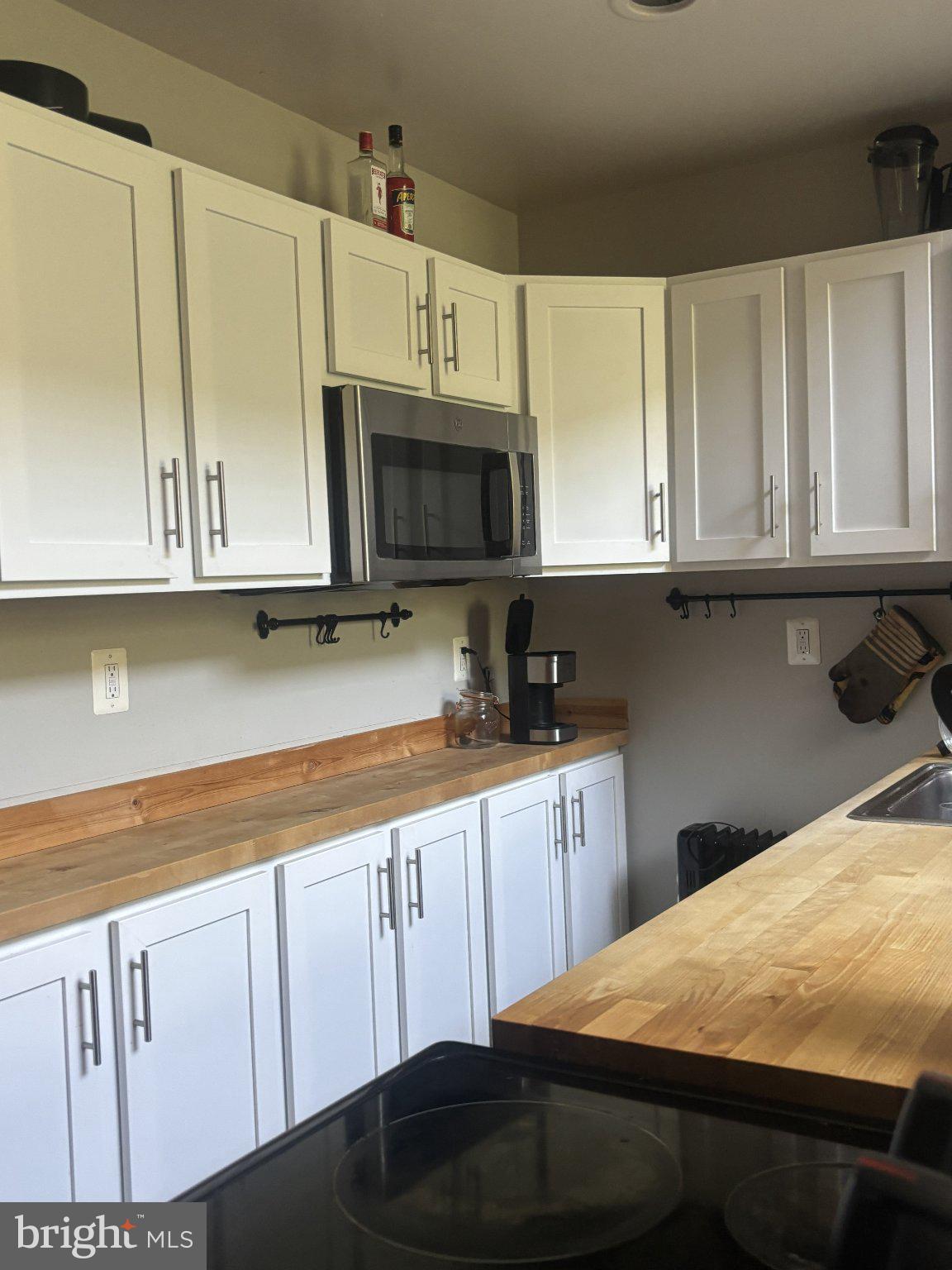 1010 Clinton Street, Unit 3M Philadelphia, PA 19107 - Photo 15 of 15 Modern kitchen with sleek cabinetry.