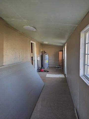 a furnished livingroom with a window