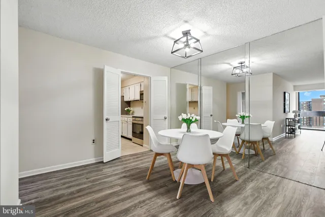 a view of a dining room with furniture and wooden floor