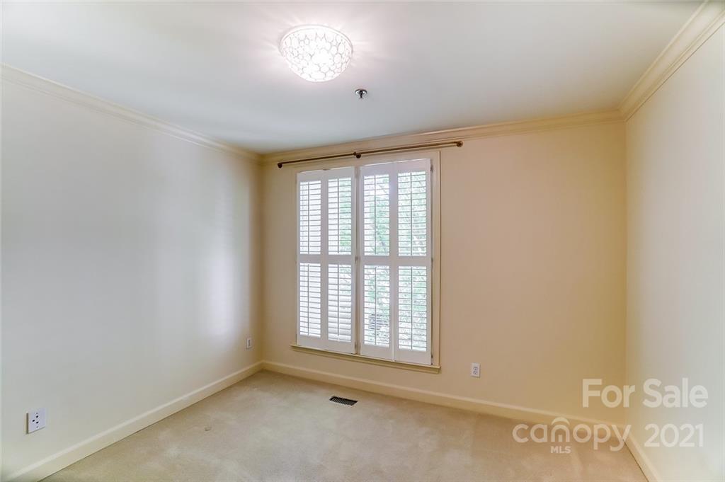 416 Queens Road, Unit 14 Charlotte, NC 28207 - Photo 15 of 27 a view of an empty room with a window