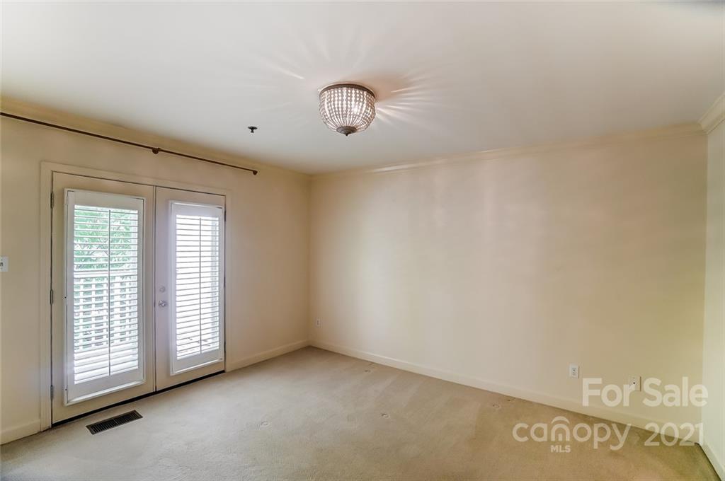 416 Queens Road, Unit 14 Charlotte, NC 28207 - Photo 20 of 27 a view of an empty room with a window