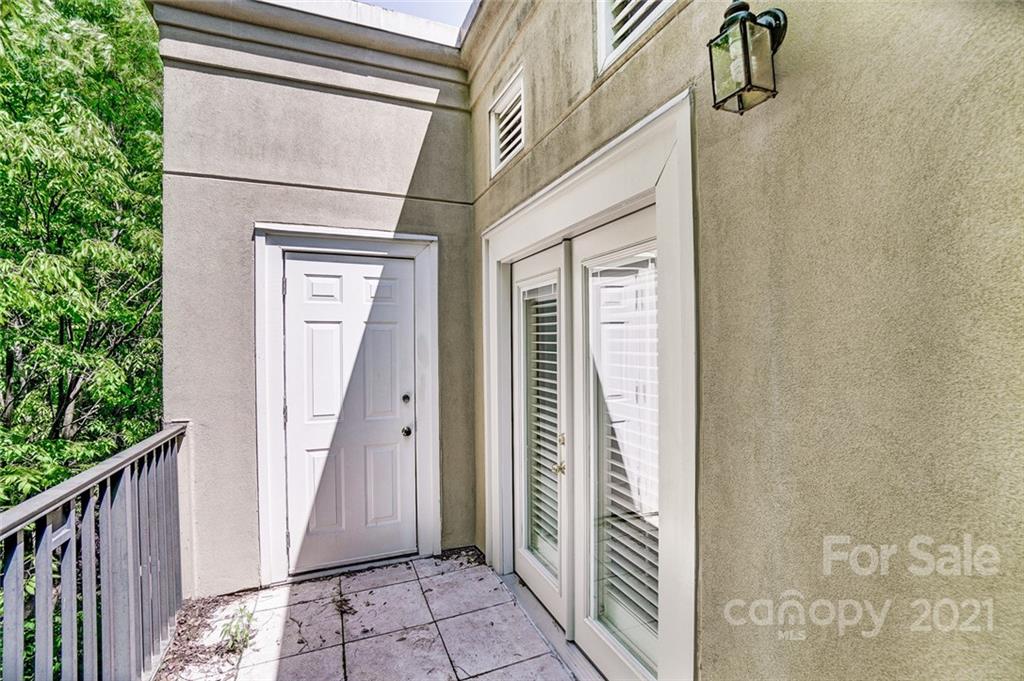 416 Queens Road, Unit 14 Charlotte, NC 28207 - Photo 23 of 27 a view of a door and wooden floor