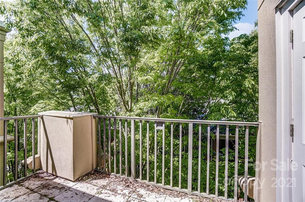 416 Queens Road, Unit 14 Charlotte, NC 28207 - Photo 24 of 27 a view of a balcony with wooden fence