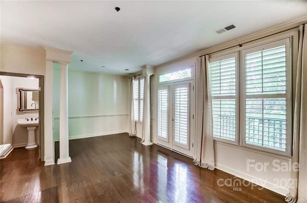 416 Queens Road, Unit 14 Charlotte, NC 28207 - Photo 8 of 27 a view of livingroom with hardwood floor and window