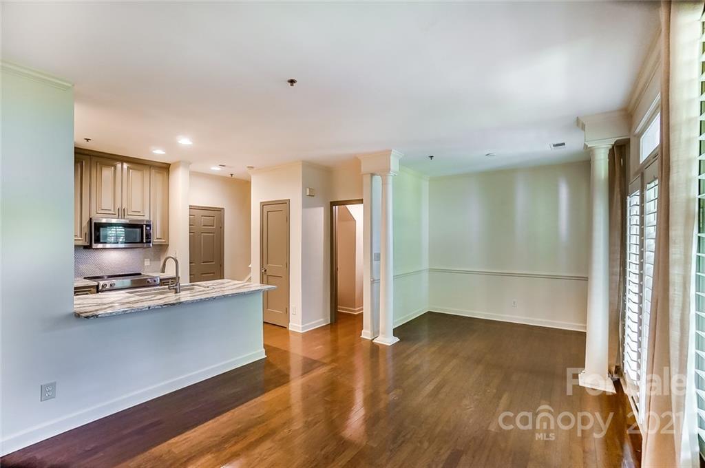 416 Queens Road, Unit 14 Charlotte, NC 28207 - Photo 9 of 27 a view of kitchen with stainless steel appliances refrigerator oven and cabinets