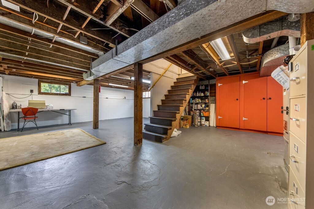 1206 North 2nd Street Renton, WA 98057 - Photo 16 of 24 a view of an empty room with wooden ceiling