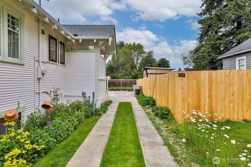 1206 North 2nd Street Renton, WA 98057 - Photo 19 of 24 a view of a back yard with flower plants