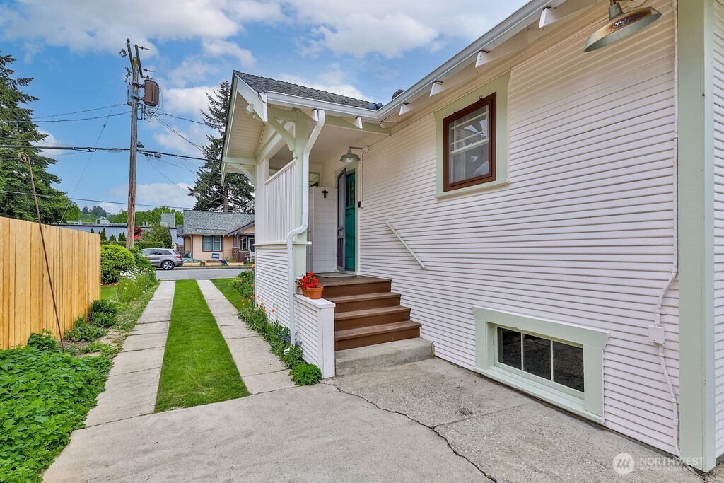 1206 North 2nd Street Renton, WA 98057 - Photo 20 of 24 a front view of a house with a yard