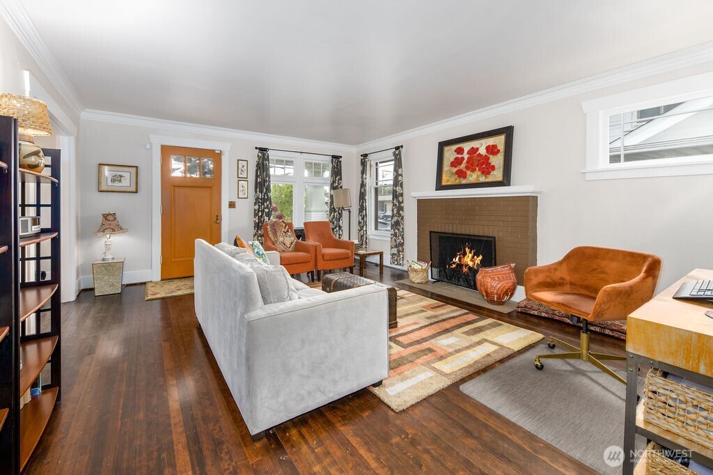 1206 North 2nd Street Renton, WA 98057 - Photo 4 of 24 a living room with furniture and a fireplace