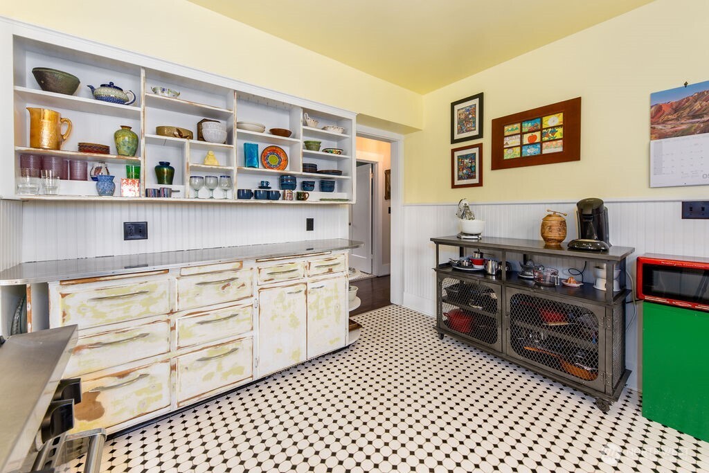 1206 North 2nd Street Renton, WA 98057 - Photo 7 of 24 a kitchen with stainless steel appliances a stove a sink and a refrigerator