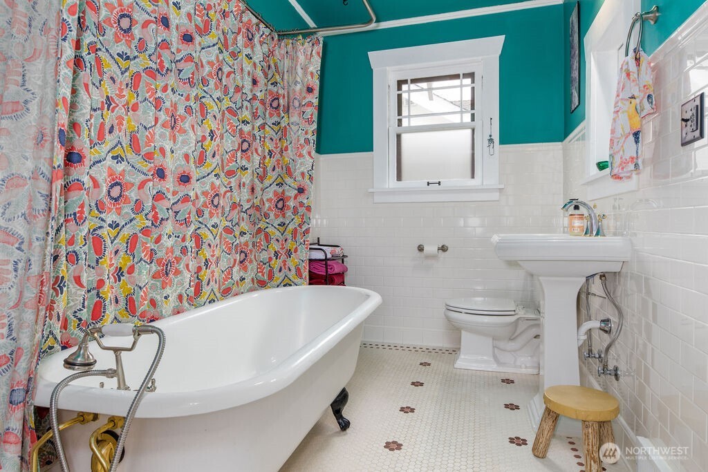 1206 North 2nd Street Renton, WA 98057 - Photo 10 of 24 a bathroom with a sink toilet and mirror