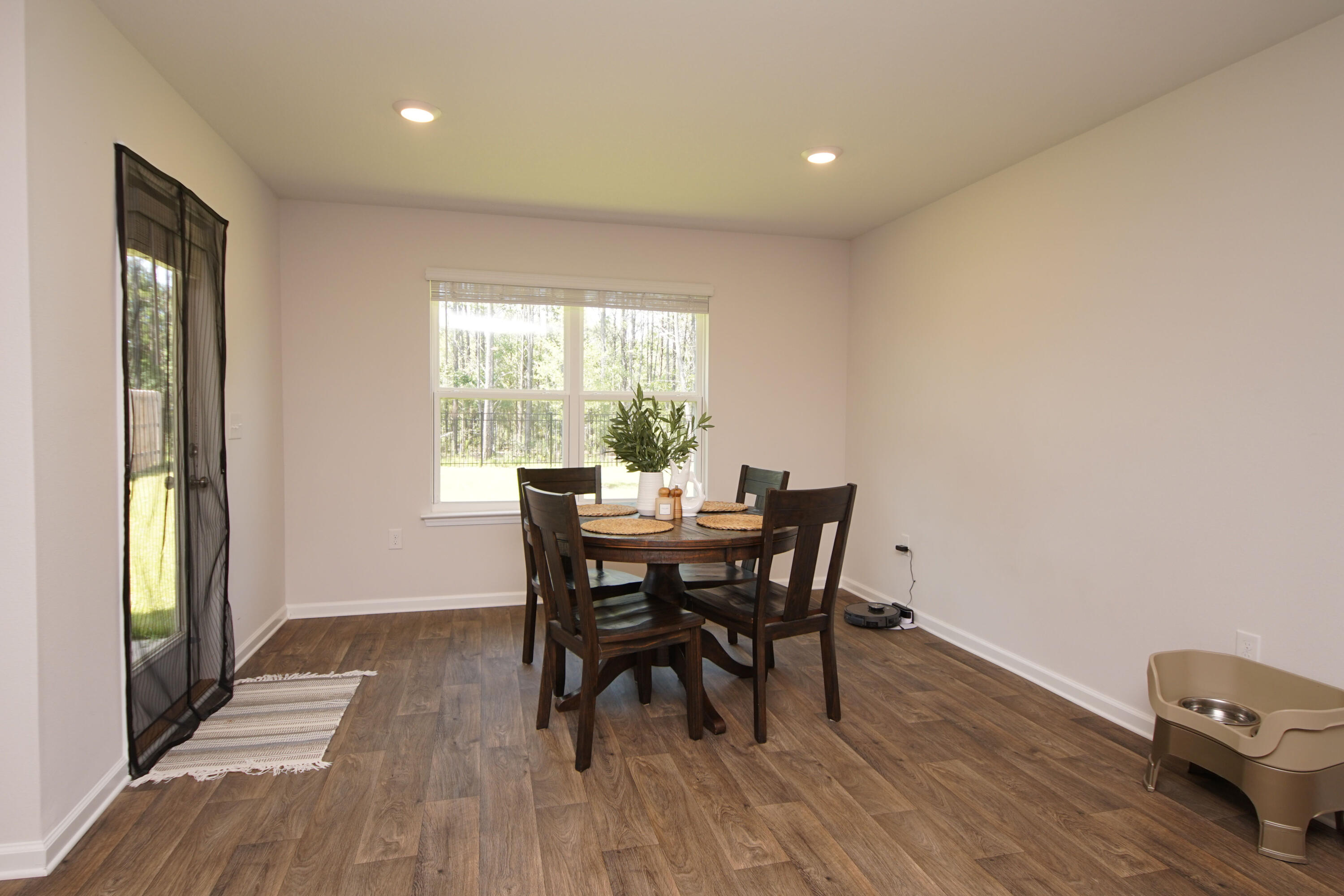 334 This Way Freeport, FL 32439 - Photo 17 of 55 a view of a dining room with furniture and wooden floor