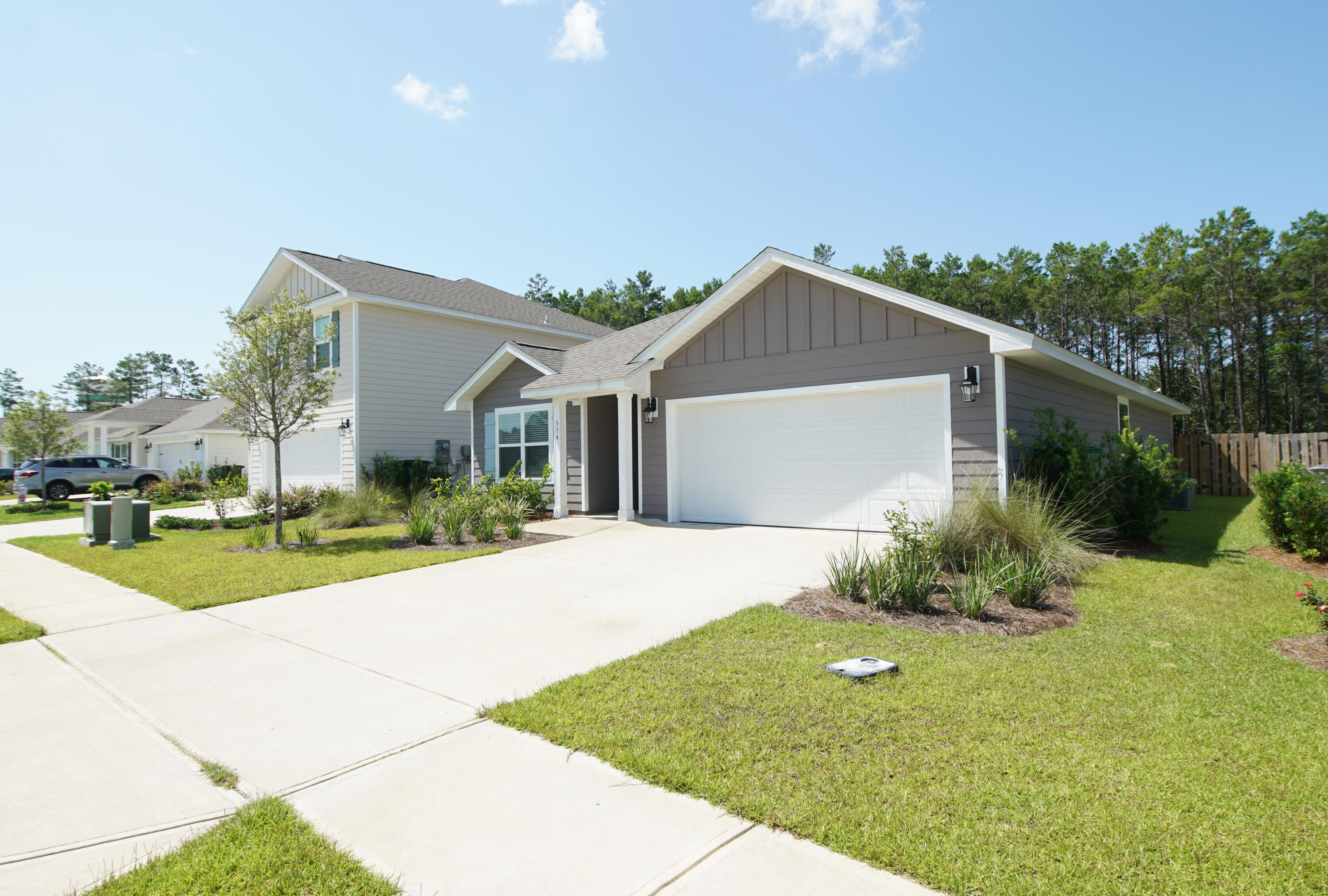 334 This Way Freeport, FL 32439 - Photo 2 of 55 a front view of a house with garden